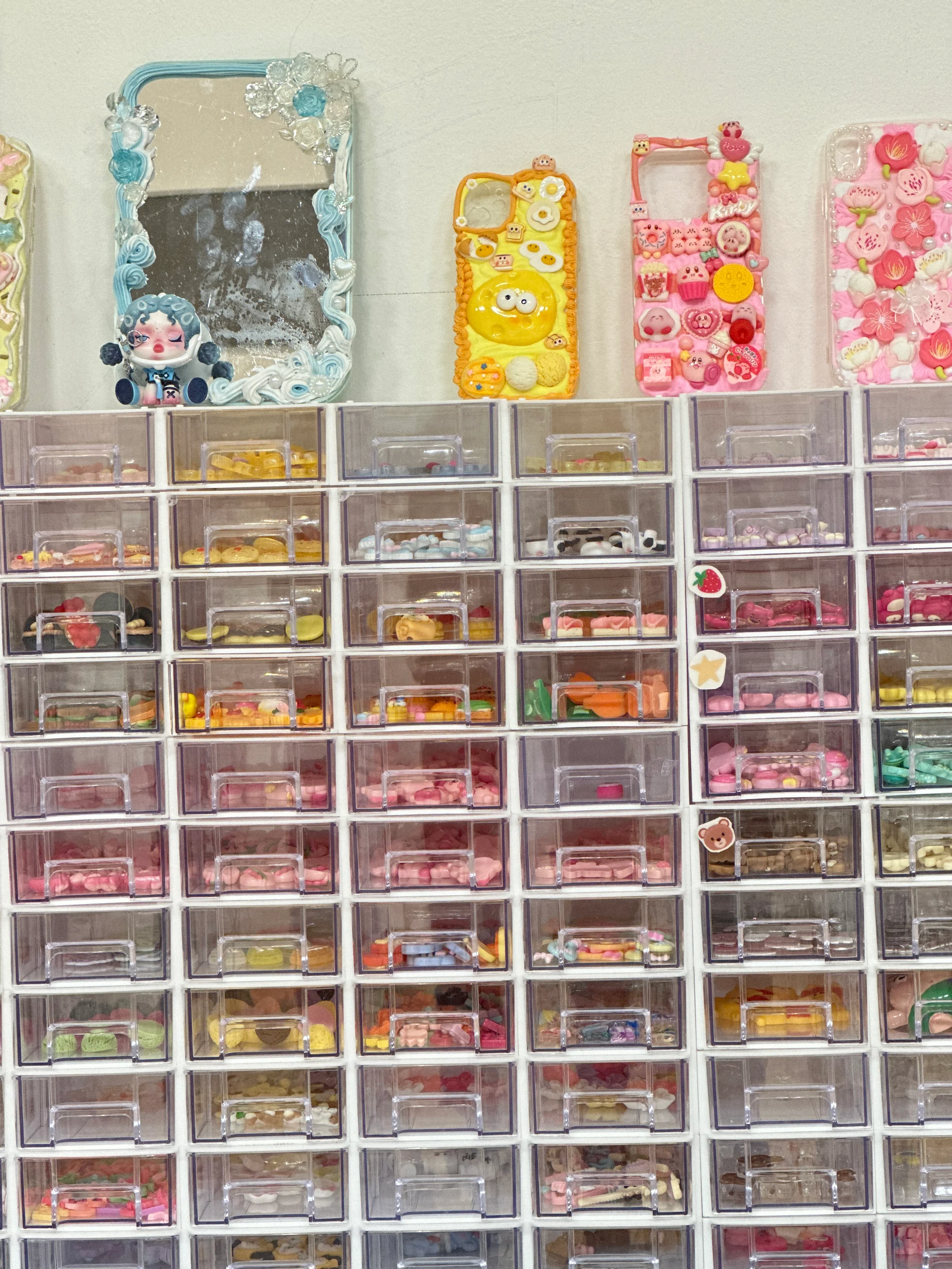 a display of many charm options at a craft workshop.