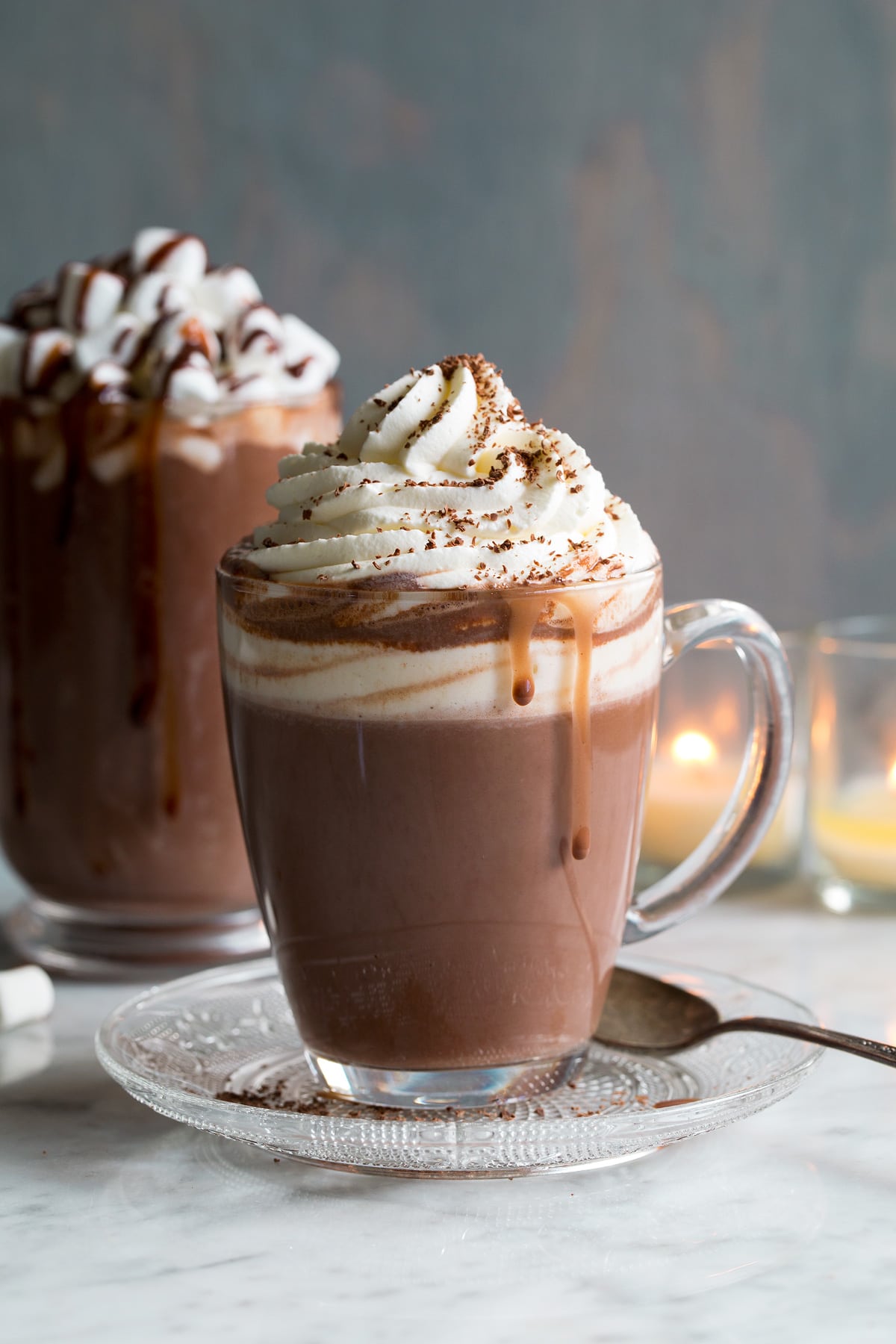 a cup of hot cocoa with whipped cream and caramel.