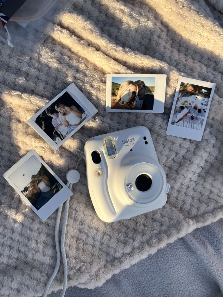 a few cute polaroid pictures laid above a camera displaying nice moments.